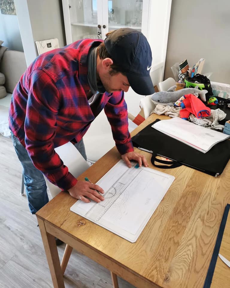 Bulldog Plumbing team member reviewing plans for a plumbing project