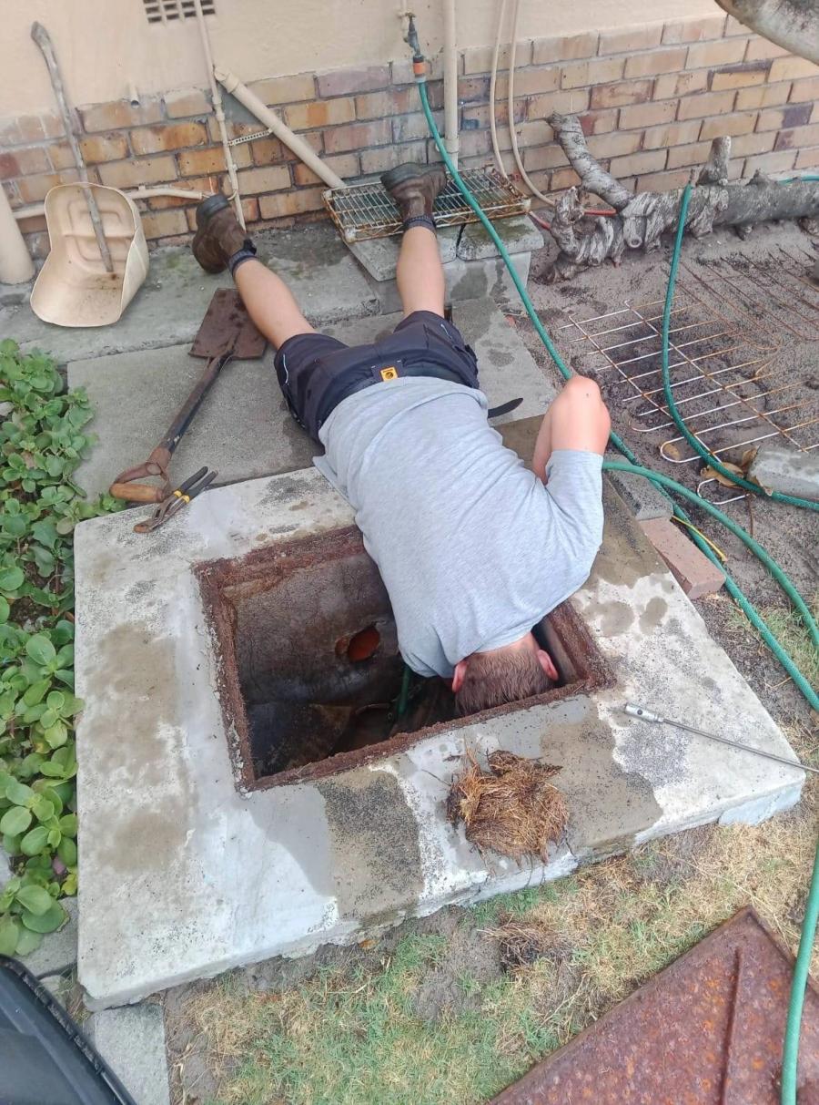 Bulldog Plumbing inspecting an underground drain